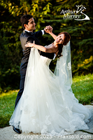 Bride and groom dancing outside in elegant wedding attire, emphasizing social dance and formal dance instruction.