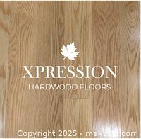 Photo of the product sample board featuring red oak hardwood with the Xpression Hardwood Floors logo watermarked.