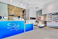 Reception desk with SKINS Derma Care logo