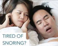 Photo showing a woman looking annoyed while her partner snores loudly, illustrating the problem of snoring.