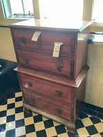 Front view of chest showing four drawers and hardware