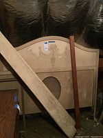 Headboard, footboard and rails stacked in attic