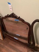 Front view showing full mirror and detached frame pieces