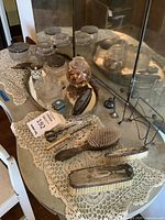 Entire vanity set on table showing tray, jars, brushes, tools