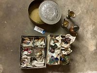 Top view showing tin, pitchers and two boxes of ornaments