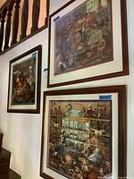 Three framed Wysocki prints hung on wall