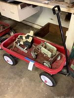 Overview of wagon containing skates and toy car