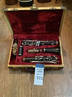 Clarinet components and accessories arranged in open case