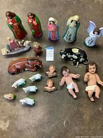 Overall view of all nativity pieces laid out on floor