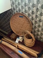 Group shot showing wicker tray, basket, stone box and stone specimen