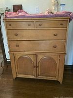 Front view showing drawers and doors