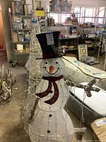 Snowman and wireframe tree standing together, showing overall appearance