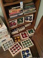 Books on shelves and ornament boxes displayed below