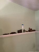 Shelf view showing five separate vintage tool components