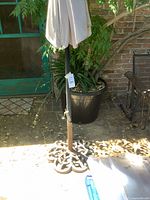 Umbrella base and lower pole with tag visible