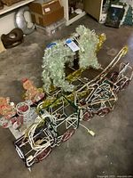 Overall view of train, reindeer and gingerbread figures showing wiring and tinsel