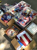 Overview of bins and boxes containing flags, pinwheels, plates, fabric pieces