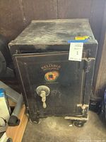 Full view of antique safe on wheels