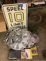 Group view of all items including sign, ration container, hubcaps and packaged accessories