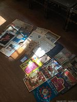 Lot overview showing all magazines and papers spread on floor