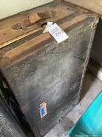 Full view of trunk front showing metal body and wear