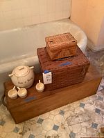Overall lot showing punch bowl, mugs, two wicker baskets, wooden chest