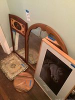 Group shot showing mirrors, trays and framed art