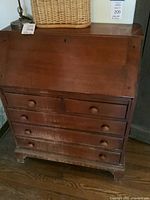 Front view showing desk, drawers and finish