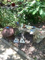 Group view showing bench, metal mushroom, birdhouses and small figures