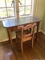 Desk with chair placed under window