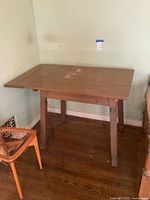 Overall view of wooden table against wall