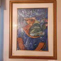 Full view of the framed abstract portrait painting of a woman in warm and cool tones, with ornate gold frame and white matte border.