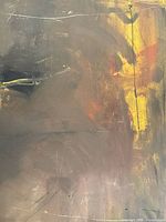 Close-up photo of the back of the painting showing signature, numbering, and title with visible texture and paint colors.