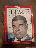 Front cover of a vintage Time magazine Canada edition dated August 11, 1961 with a color illustration of Whitney Young and a clock face background.