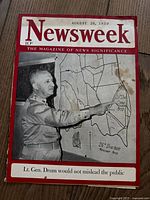Cover photo showing the magazine front with Lt. Gen. Drum pointing at a military map, stained and worn.