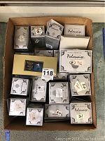Cardboard tray filled with twelve Polonaise Collection boxes of various sizes.