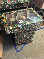 Box of assorted Old World Christmas glass ornaments including snowmen and Santa.