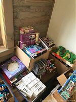 Overview of boxed craft kits and small ornaments packed in various boxes