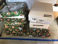 Stack of original Old World Christmas patterned boxes and plain boxes labeled 'Glitter Balls'