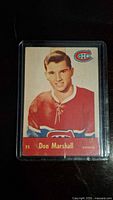 Front of the card showing Don Marshall in Montreal Canadiens uniform with team logo and player name and number