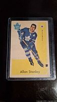 Front side of the 1959-60 Parkhurst Allan Stanley hockey card, showing the player in Toronto Maple Leafs uniform, blue and white.