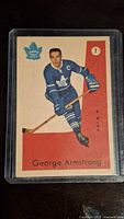 Front of the 1959-60 Parkhurst George Armstrong hockey card displaying player portrait in Toronto Maple Leafs uniform.