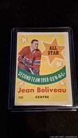 Front of Jean Beliveau 1969-70 OPC All Star hockey card, showing player image, team, and all star designation.
