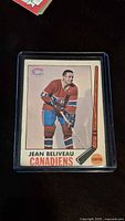 Front of 1969-70 Jean Beliveau hockey card showing player image and team logo.