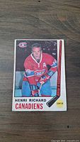 Front of hockey card: Henri Richard in Montreal Canadiens uniform, card number 163, showing name, position as center, team logo, and player image.