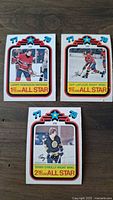 Front view of the 3 hockey cards showing players Larry Robinson, Guy Lafleur, and Terry O'Reilly with 1978 OPC All Star design.
