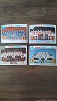 Front of four 1978 OPC hockey team cards showing Buffalo Sabres, Washington Capitals, Boston Bruins, and Toronto Maple Leafs teams.