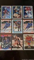 Photo showing the front of 9 Guy Lafleur hockey cards displaying various in-game action and portraits.