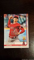 Front of the Shohei Ohtani Topps 2018 Rookie Cup baseball card showing pitching image and Rookie Cup trophy logo.