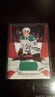 Front of Thomas Harley rookie card showing player image, team logo, and jersey patch.